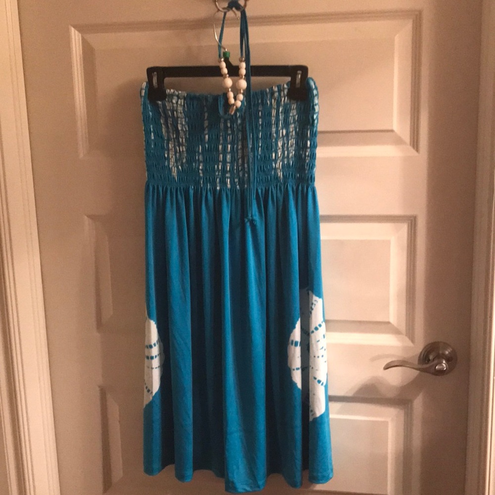 Summer dress.  Tie around neck with beads. Turquoise and white.
